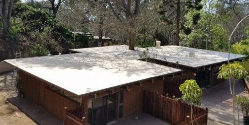 Person Is Spraying Foam Insulation — Nebraska City, NE — Midwest Custom Coatings