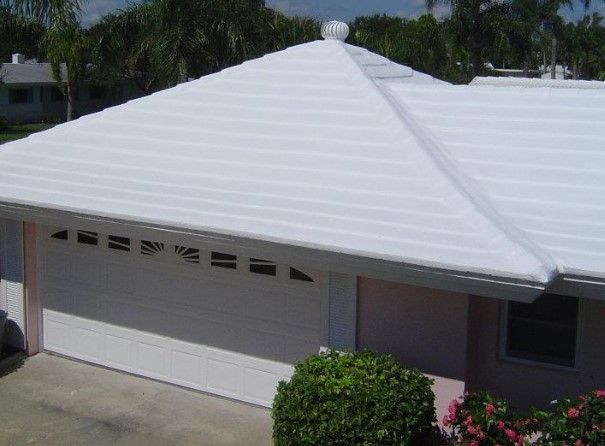 Man Insulating the Ceiling — Nebraska City, NE — Midwest Custom Coatings