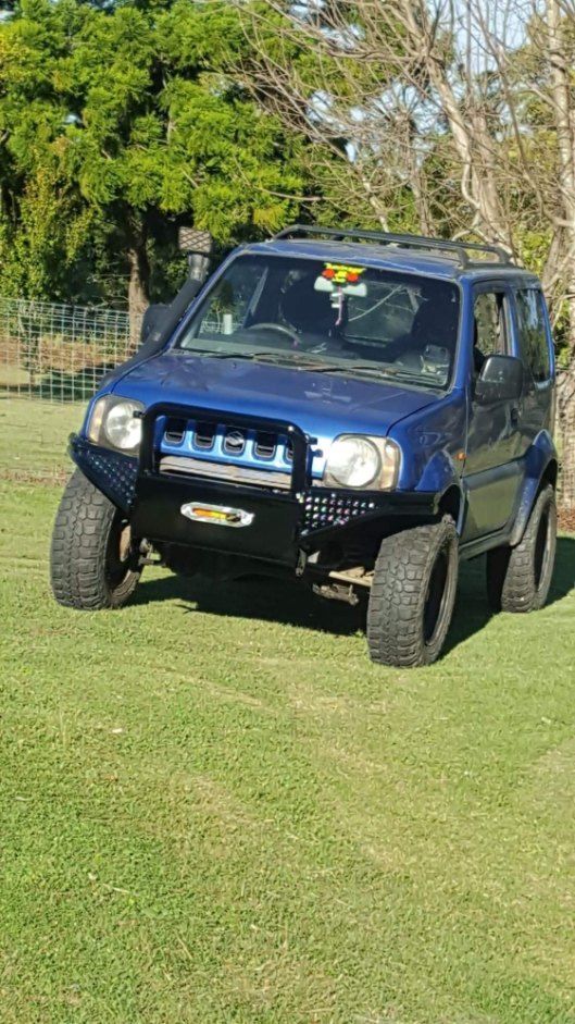 Arafed Vehicle Parked in a Field With a Fence in the Background — AWE Engineering in South Lismore, NSW