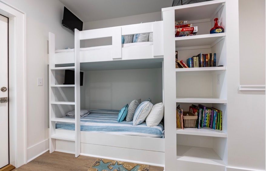 Built in twin size bunks, each with their own tv, at Rest Ashore in Gulf Shores, Alabama