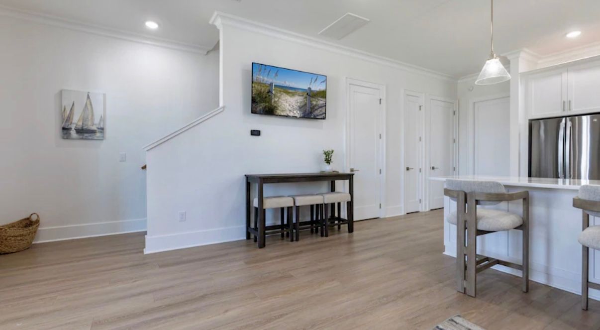 Spacious open concept living room with extra large eat at bar at Rest Ashore rental in Gulf Shores Alabama