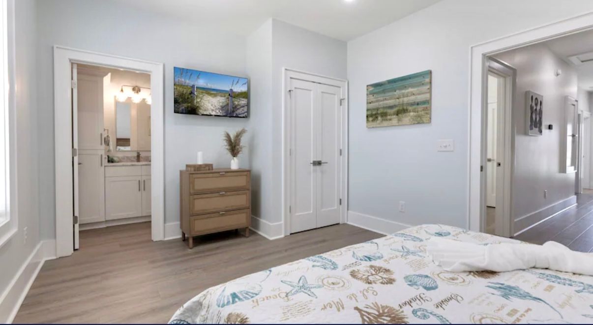 Upstairs Queen Bedroom & Ensuite W/tile shower Queen size bedroom with Private Tile shower en-suite featuring hand held wand at Rest Ashore in Gulf Shores, Alabama