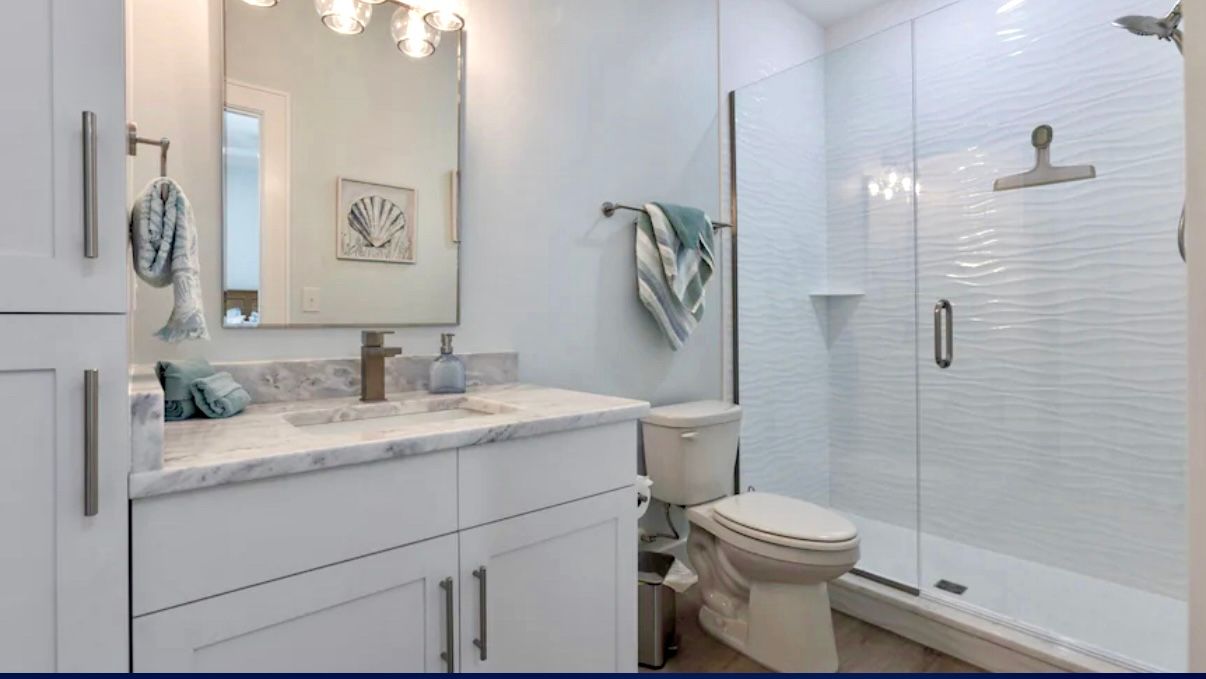 Upstairs Queen Bedroom & Ensuite W/tile shower Beautiful Tile Shower at Rest Ashore in Gulf Shores, Alabama