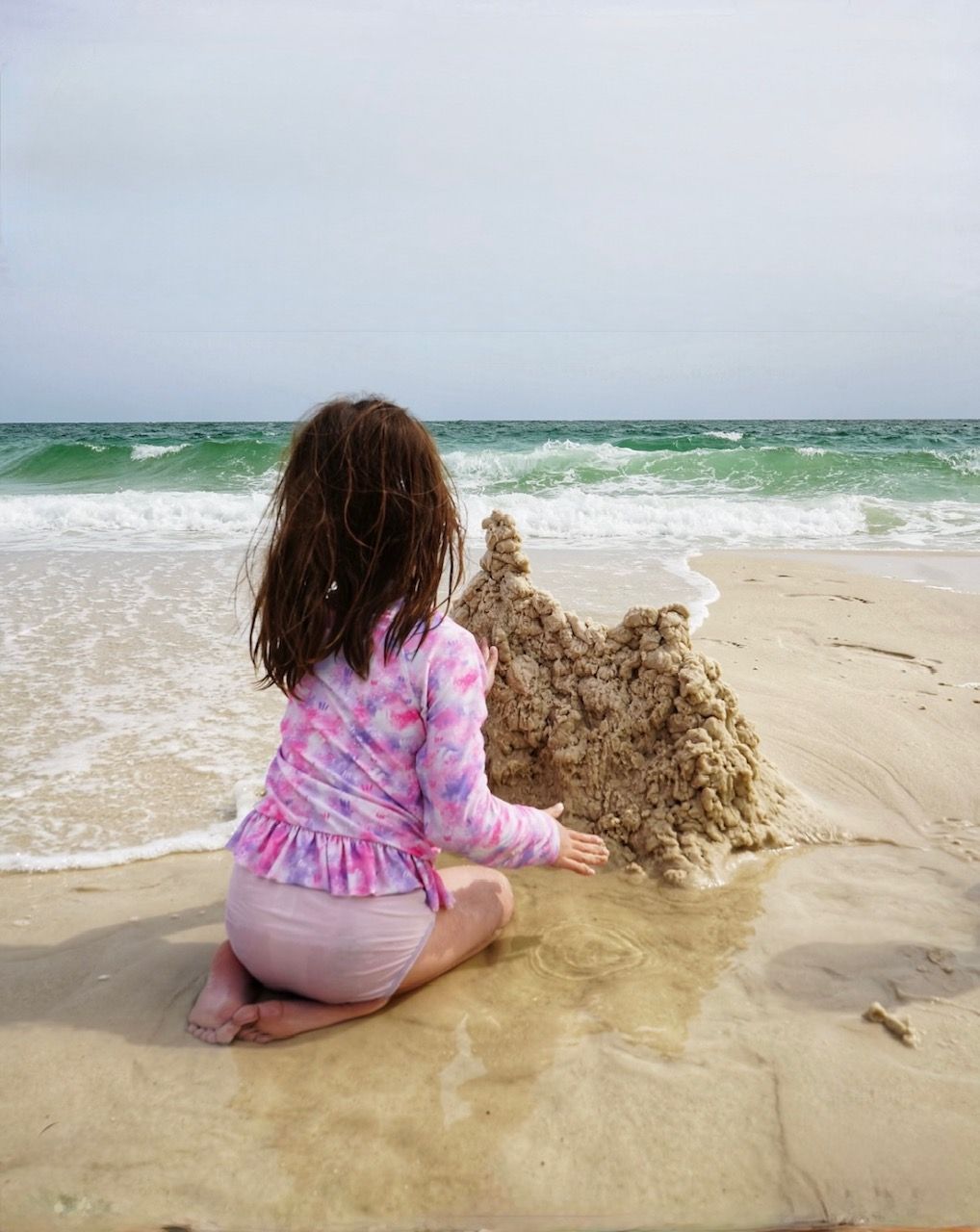 child playing on beach