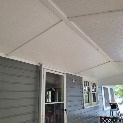 A house with a porch and a white ceiling.