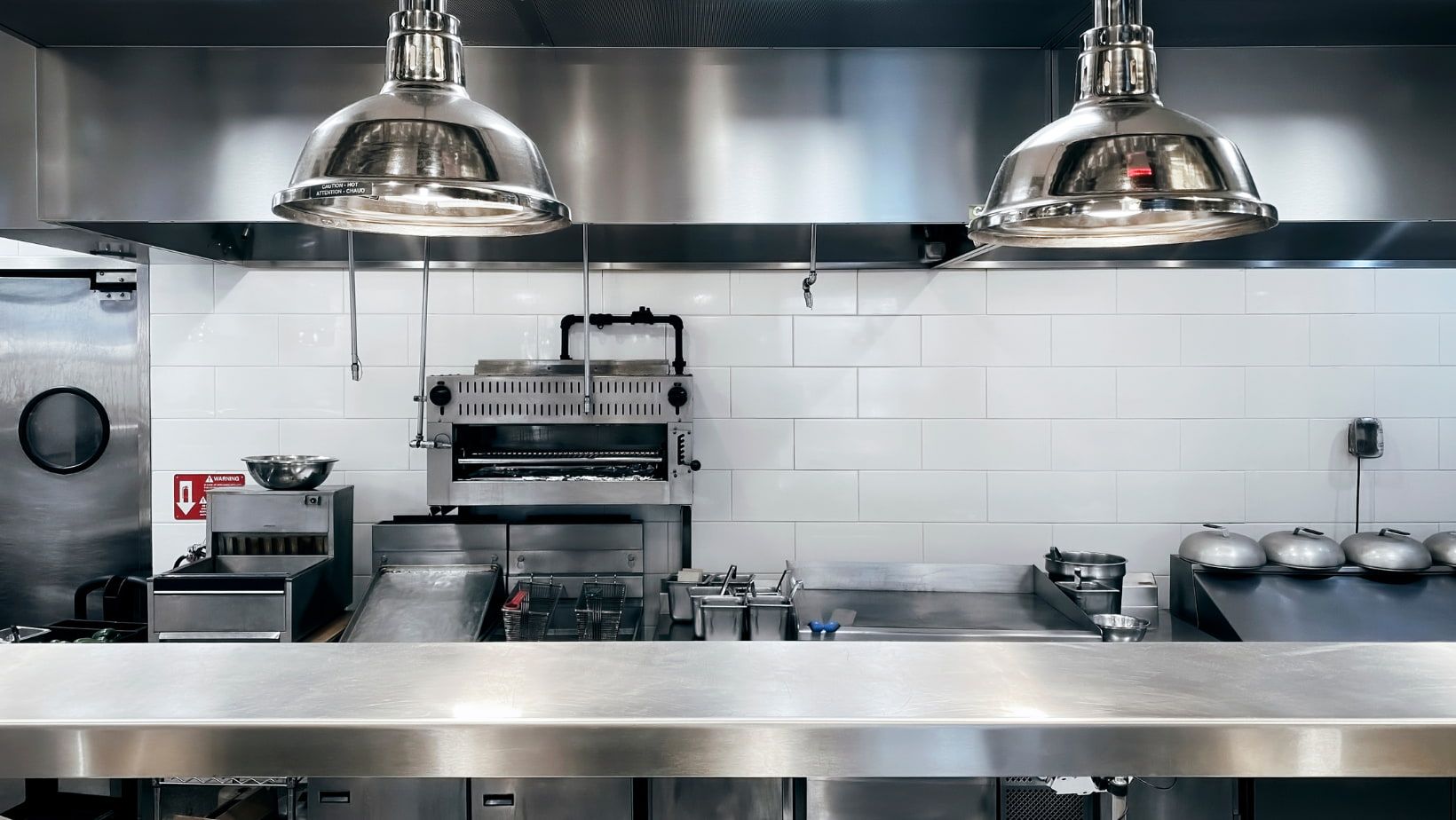 a kitchen with a red fire extinguisher on the wall - equipment finance