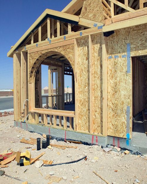 a house that is being built with a large window - construction loan gold coast