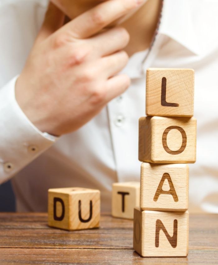 the word loan is written on a wooden block - finance broker gold coast