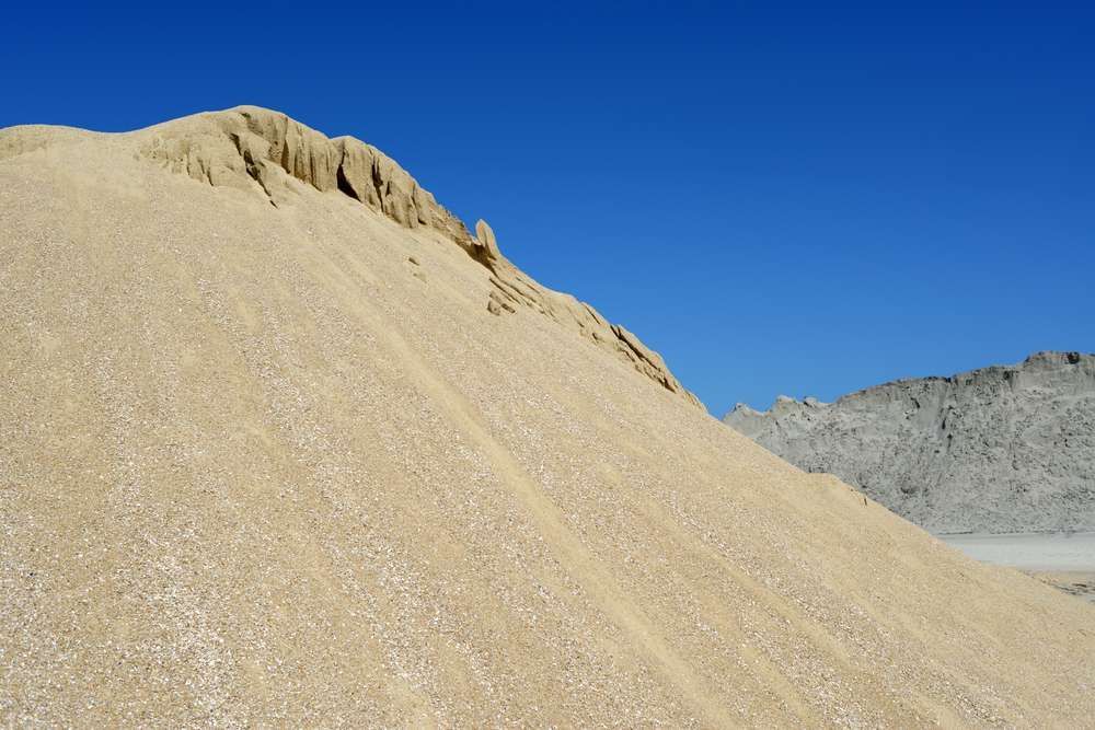 A Large Pile Of Sand Against A Blue Sky — HKL Landscape Supplies in Gloucester, NSW