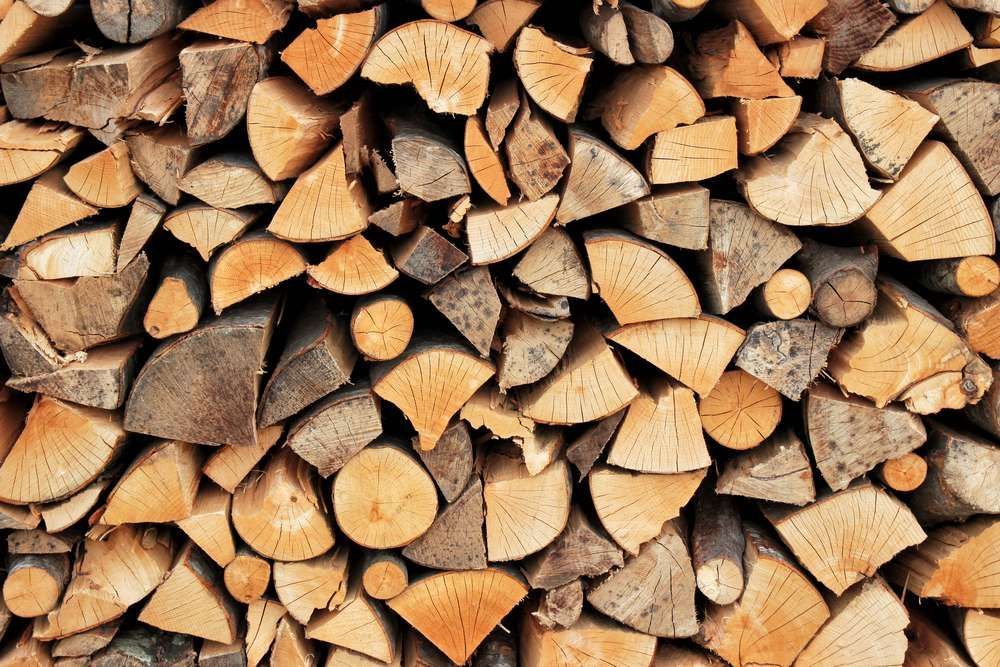 A Pile Of Chopped Wood Is Stacked On Top Of Each Other — HKL Landscape Supplies in Tuncurry, NSW 