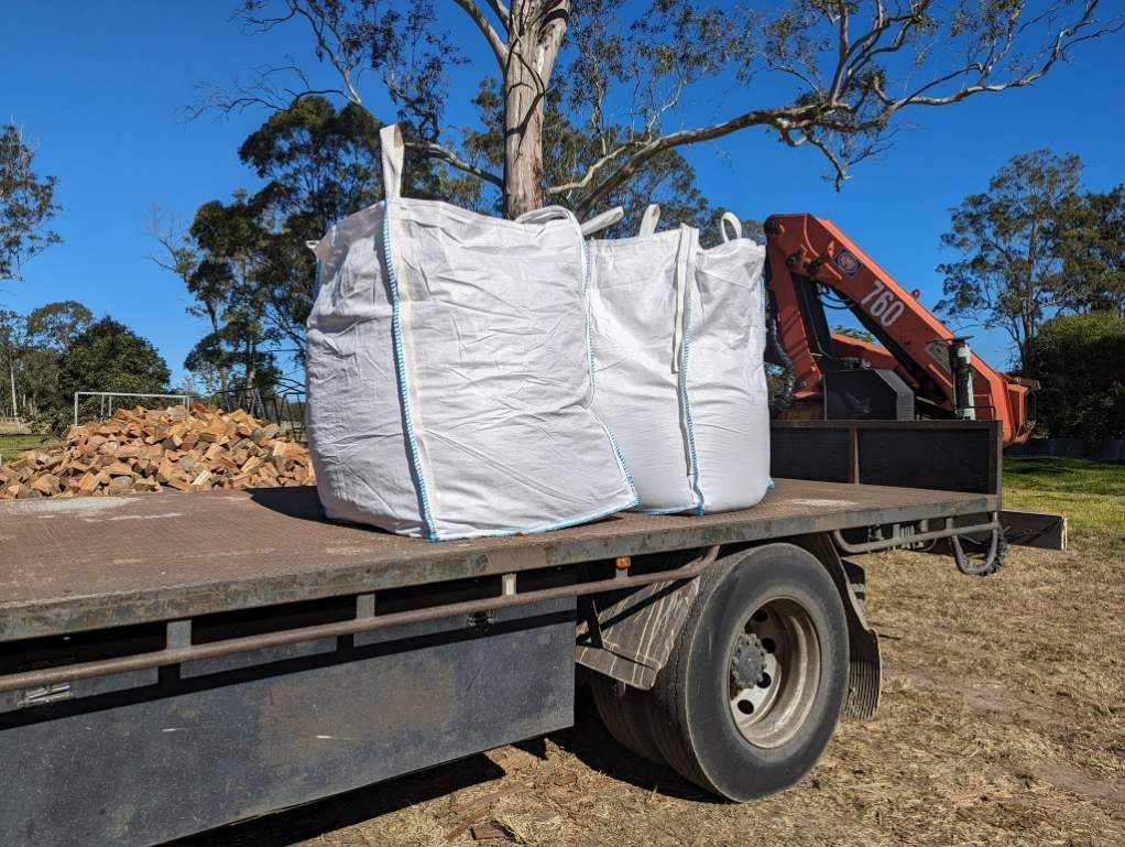 A Truck With Two Bags on the Back of It — HKL Landscape Supplies in Forster, NSW 