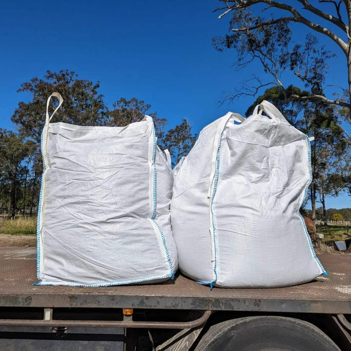 Two Bulk Bags Are Sitting On The Back Of A Truck — HKL Landscape Supplies in Taree South, NSW
