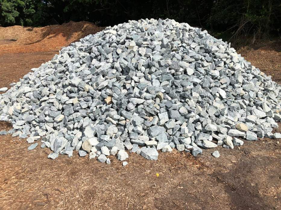 A Pile of Gravel is Sitting on Top of a Dirt Field — HKL Landscape Supplies in Tuncurry, NSW