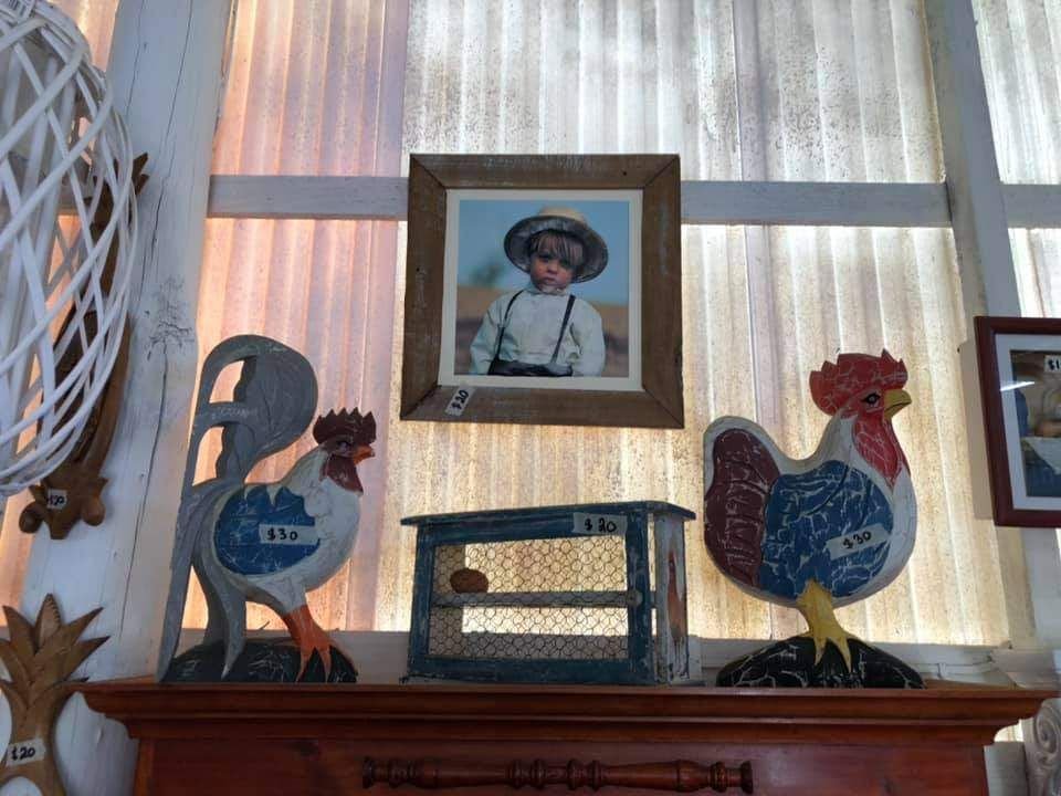 A Mantle With A Picture Of A Boy And Two Roosters On It — HKL Landscape Supplies in Harrington, NSW