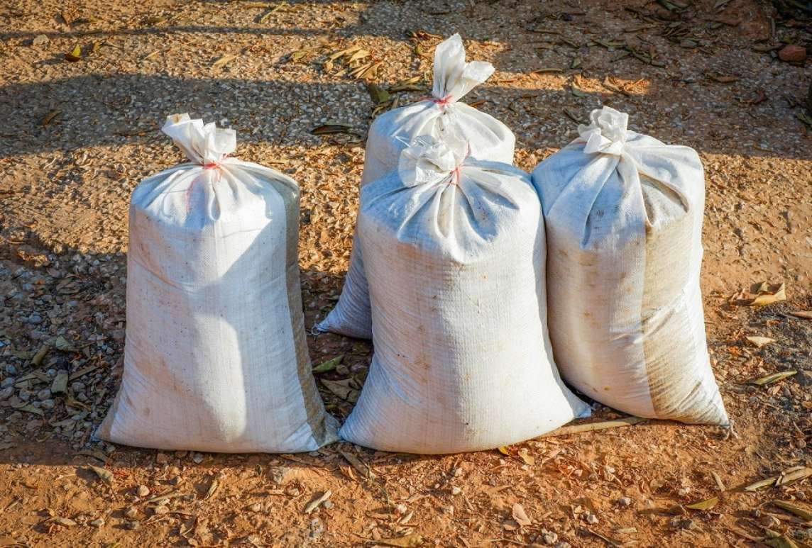 Three Bags Of Sand Are Sitting On The Ground — HKL Landscape Supplies in Coolongoolook, NSW