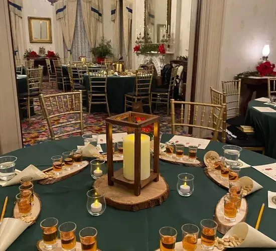 Decorated banquet table with candles and pastries in an elegant dining room