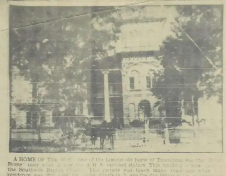 Faded newspaper photo of a large historic house with columns, partially obscured by trees and print text.