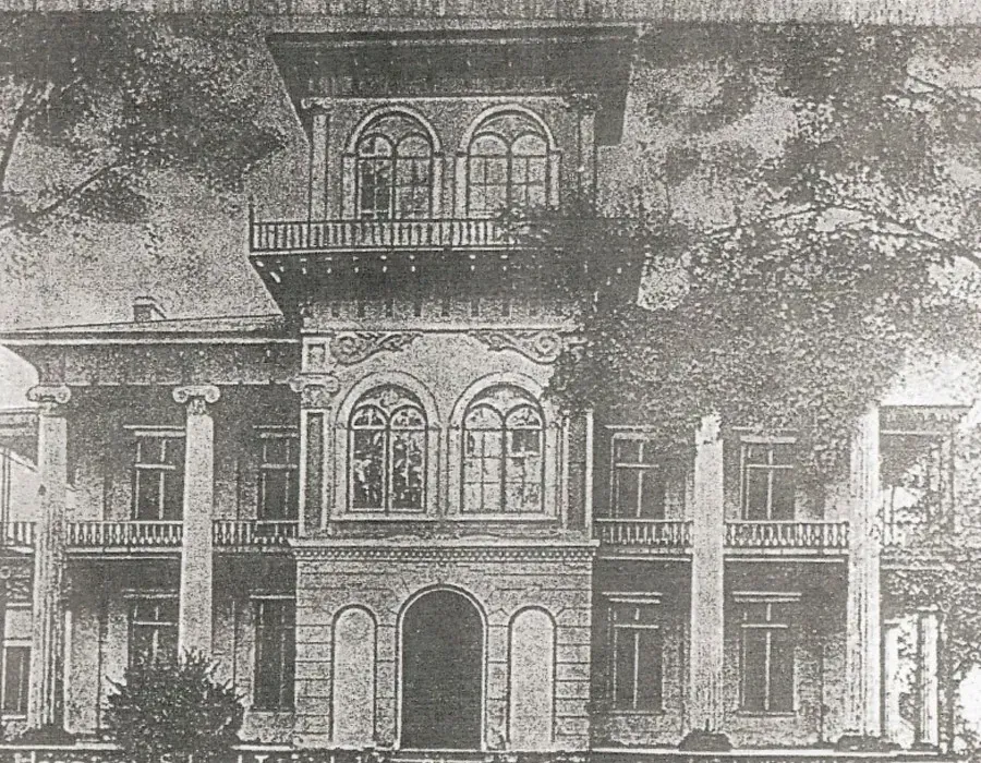 Black-and-white sketch of a historic two-story mansion with columns and arched windows, surrounded by trees.