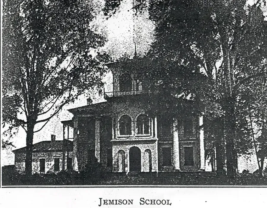Historic school building with trees in front, labeled “Jefferson School.”