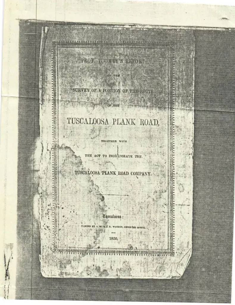 Old, faded book cover with a centered rectangular title label on a dark background.
