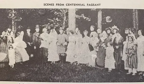 A group of people in period costumes from a 1918 Tuscaloosa centennial pageant recreation of an 1848 wedding.