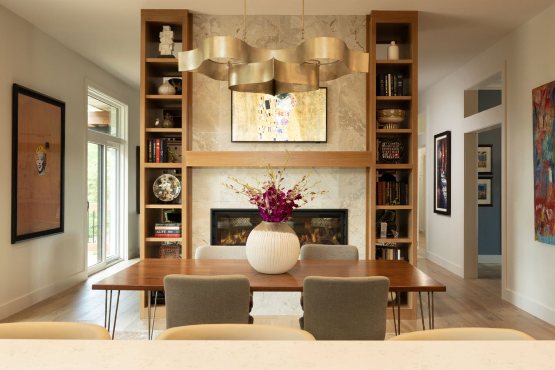 Custom built-ins and fireplace feature wall in a remodeled Springfield home by Caruso Design & Build