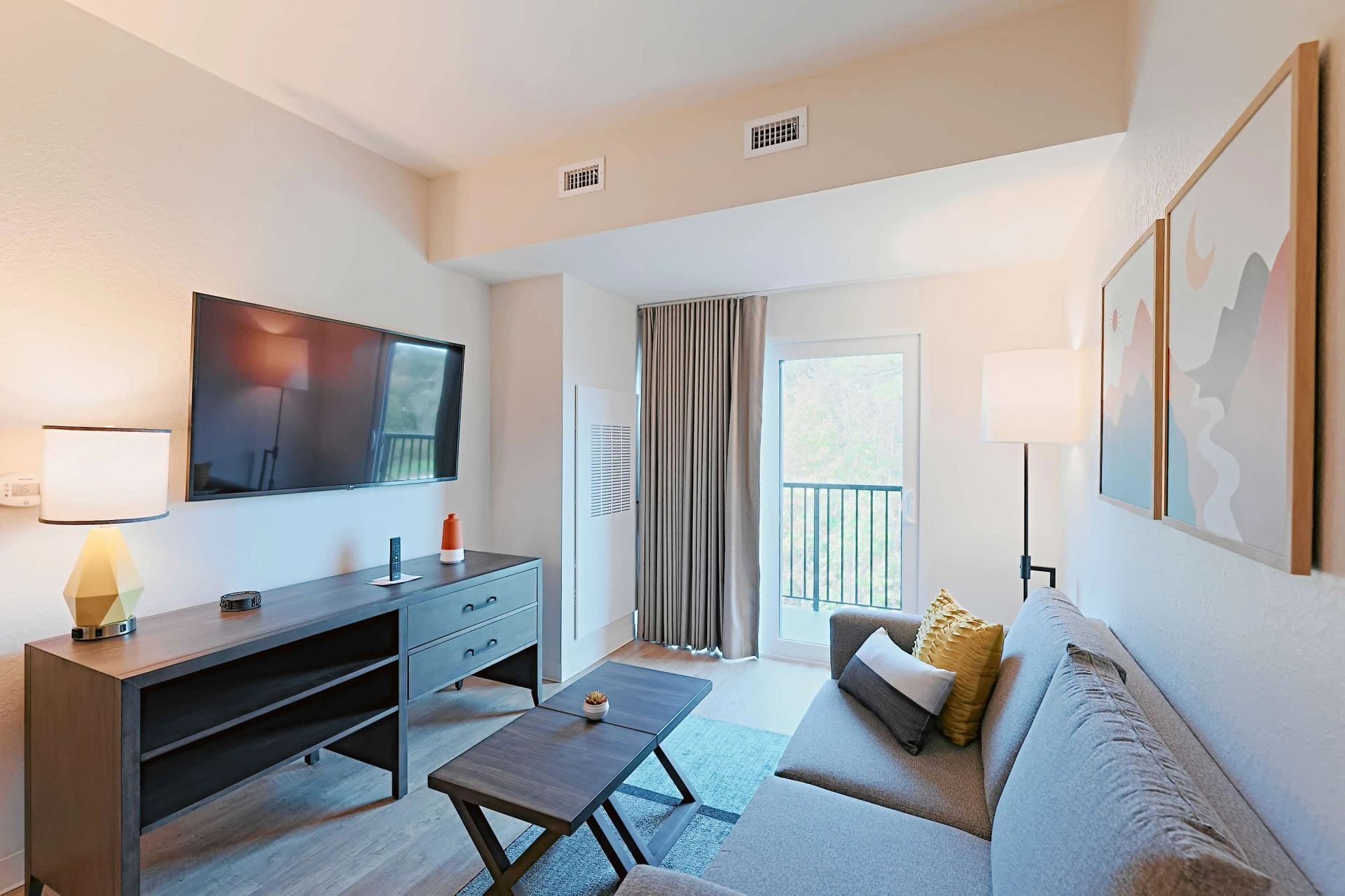 Furnished apartment living area shown — representative home at WaterWalk Phoenix – North Happy Valley.