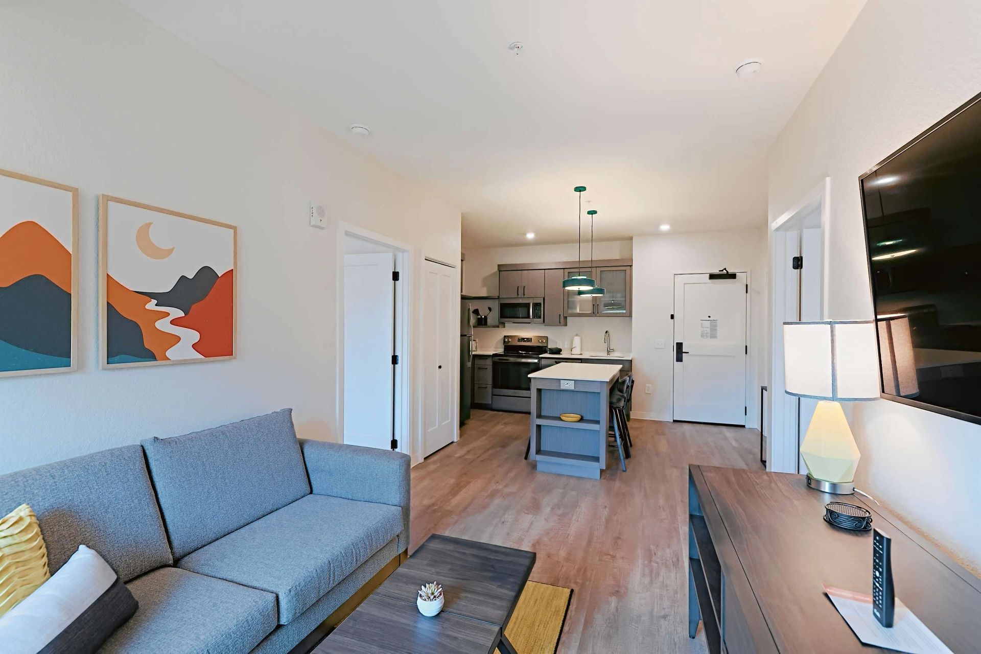 Furnished apartment living area shown — representative home at WaterWalk Phoenix – North Happy Valley.