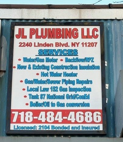 A plumber is fixing a sink pipe with a wrench.