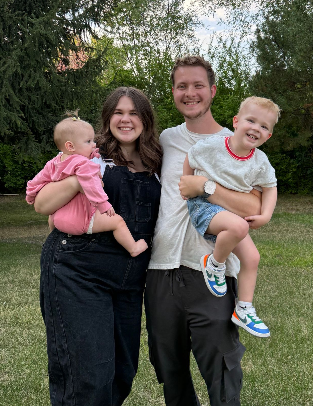 smiling parents with a toddler