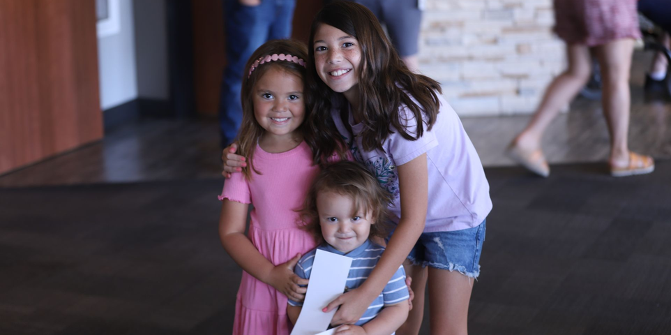 trio of three cute kids