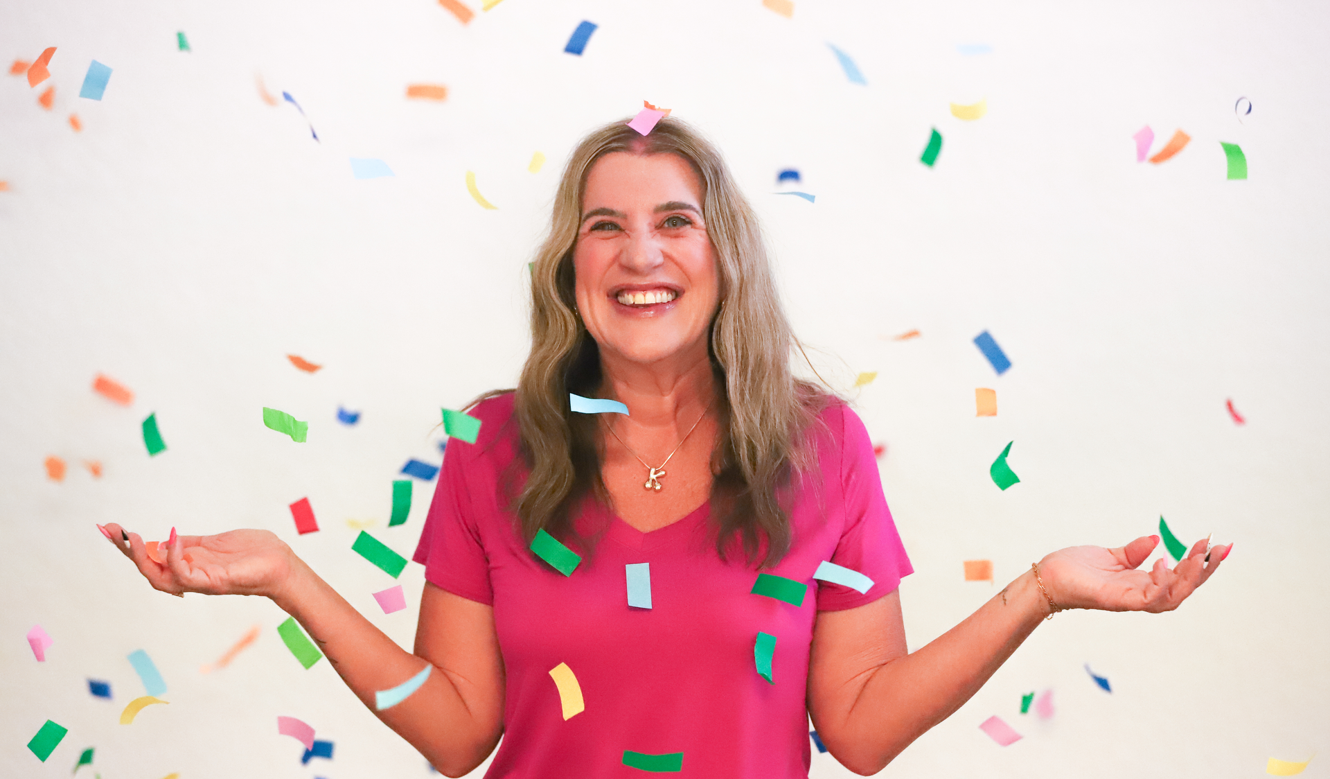 image of woman with confetti falling around her