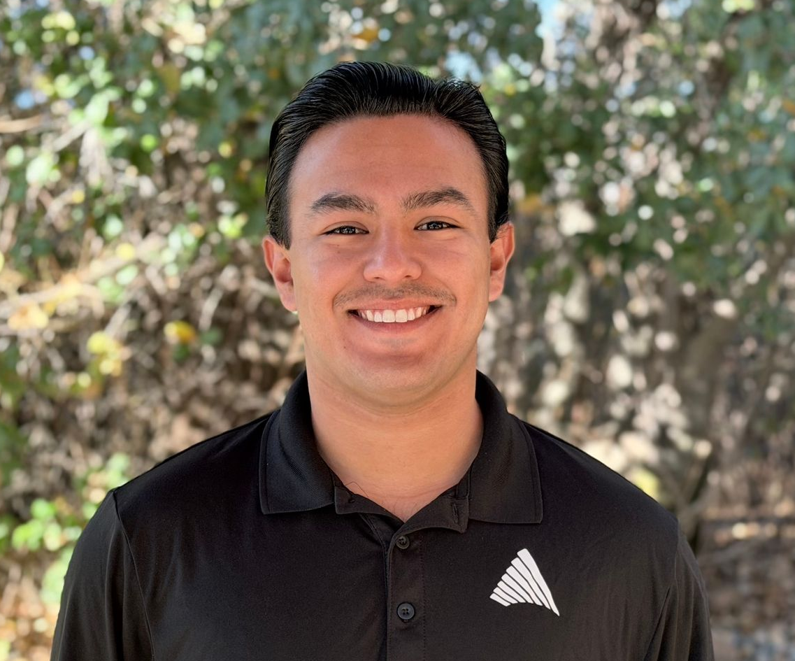 Nick, a smiling young adult who is part of our kid's staffing team