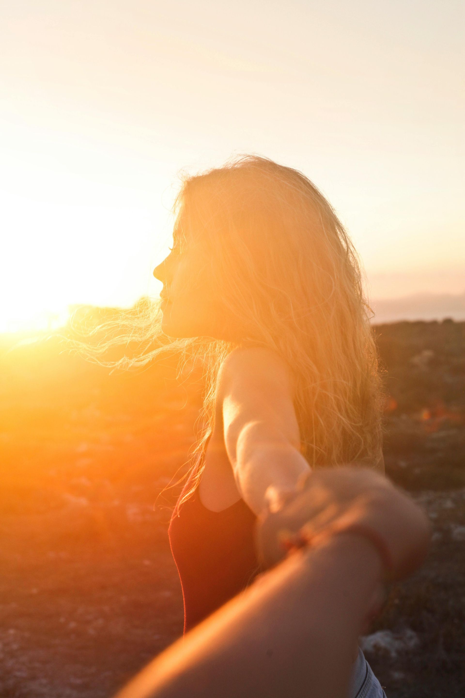 lady with sunset behind her
