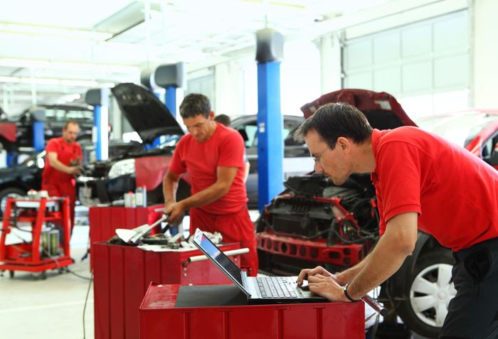 Car Mechanic Wearing Red — Kailua, HI — Fine Shine Hawaii
