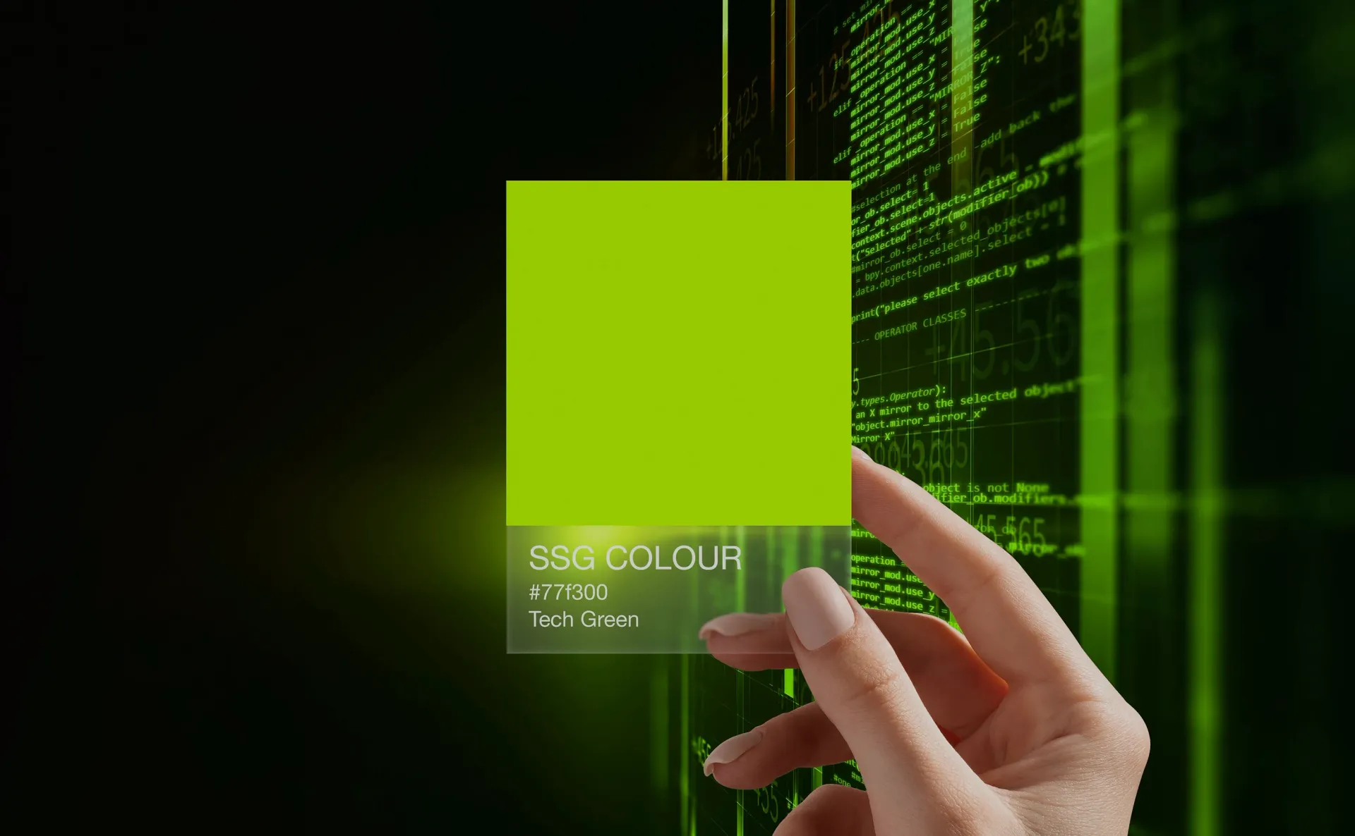 Hand holding a green color swatch in front of a digital green background.