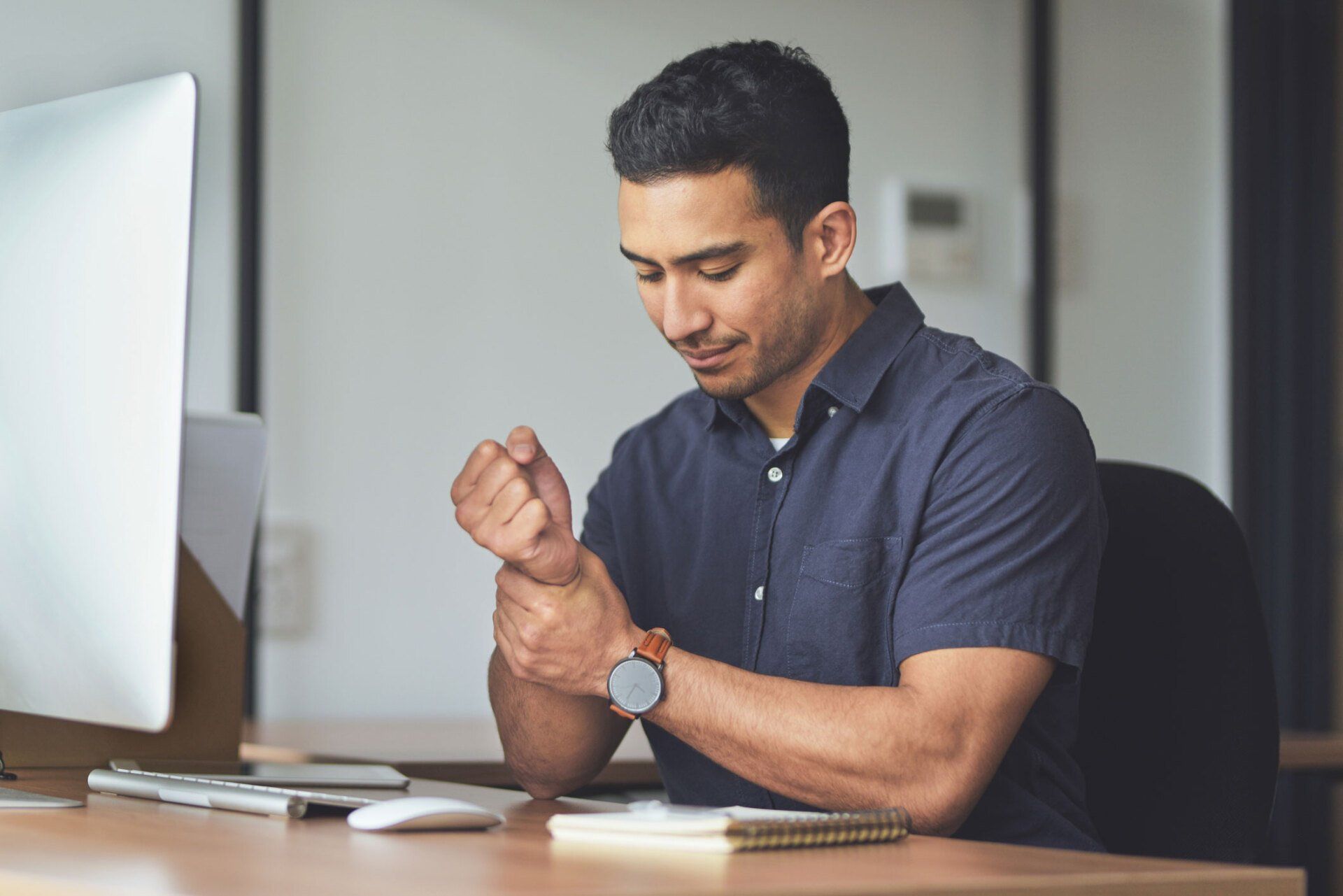 Man Holding Something In Hand | Munster, IN | Community Chiropractic Clinic