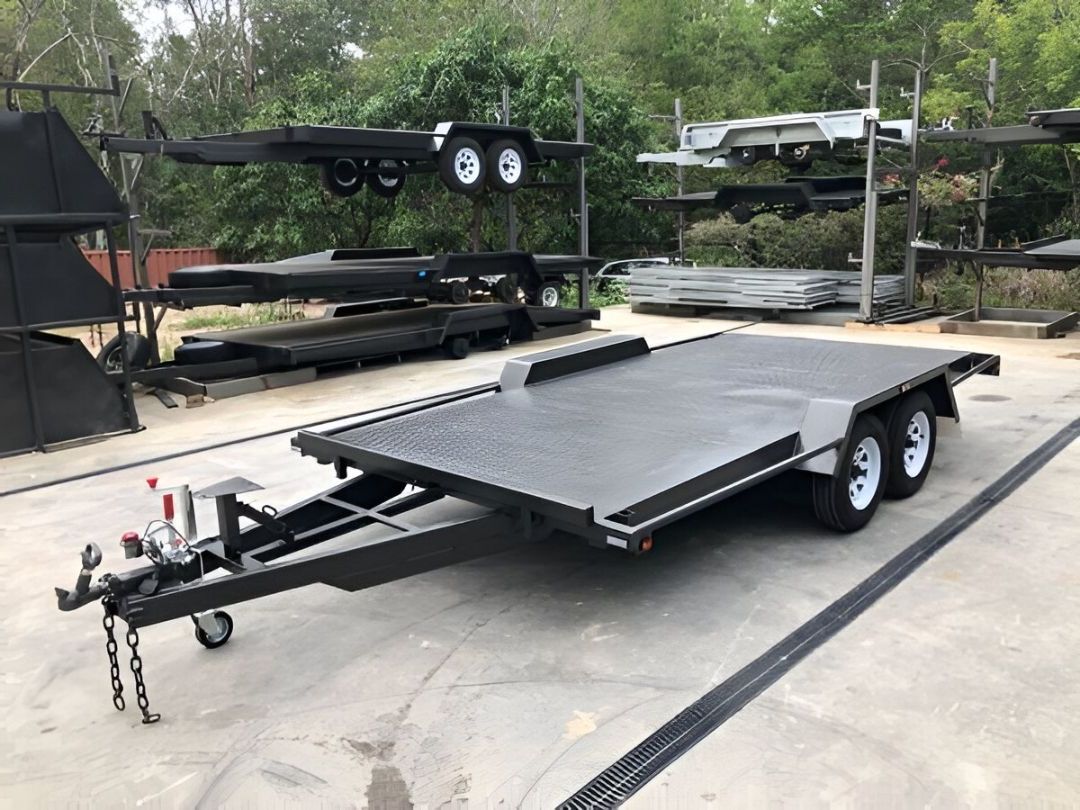 A Trailer Filled With Concrete Blocks Is Parked In The Grass — B2B Hire In Garbutt, QLD