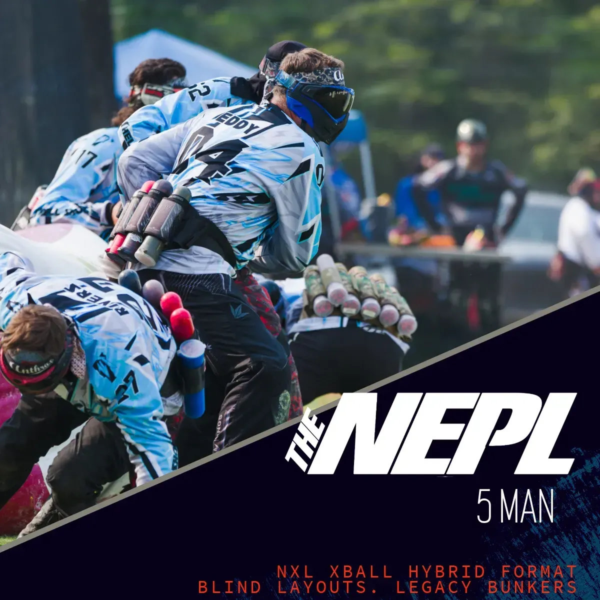 Paintball players in action at an outdoor event.