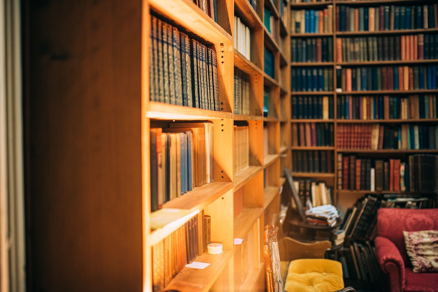 a library filled with lots of books and a couch | BXB3 Corporation | Archive Solutions in CA