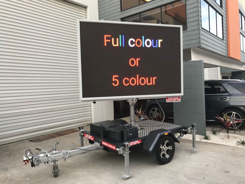 A trailer with a sign on it that says full colour or 5 colour