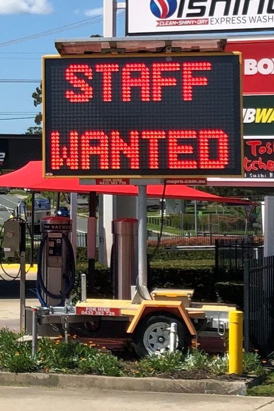 A sign that says staff wanted on it