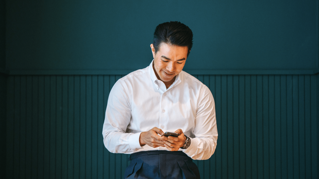 man looking at phone