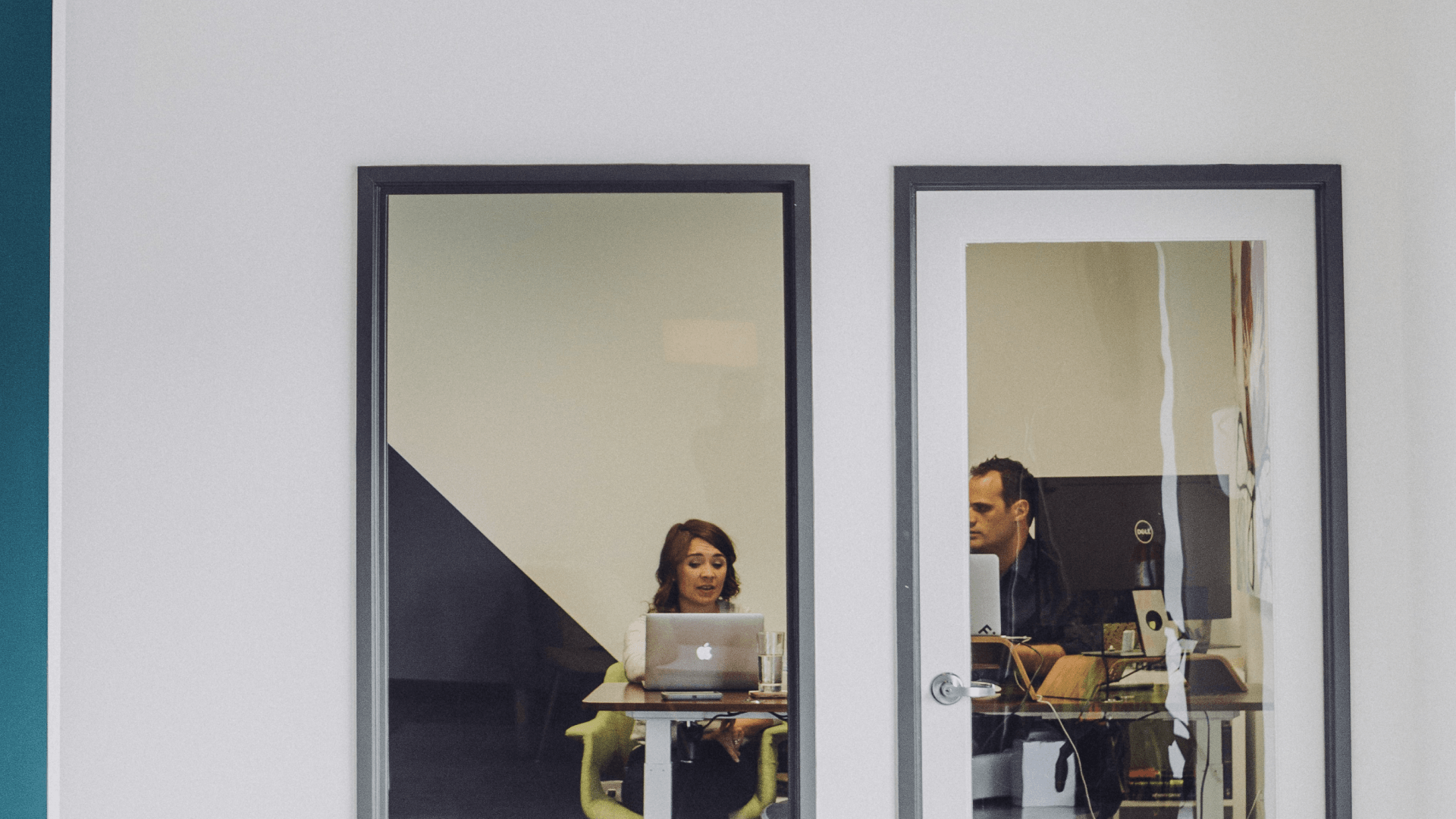 man and woman working in office