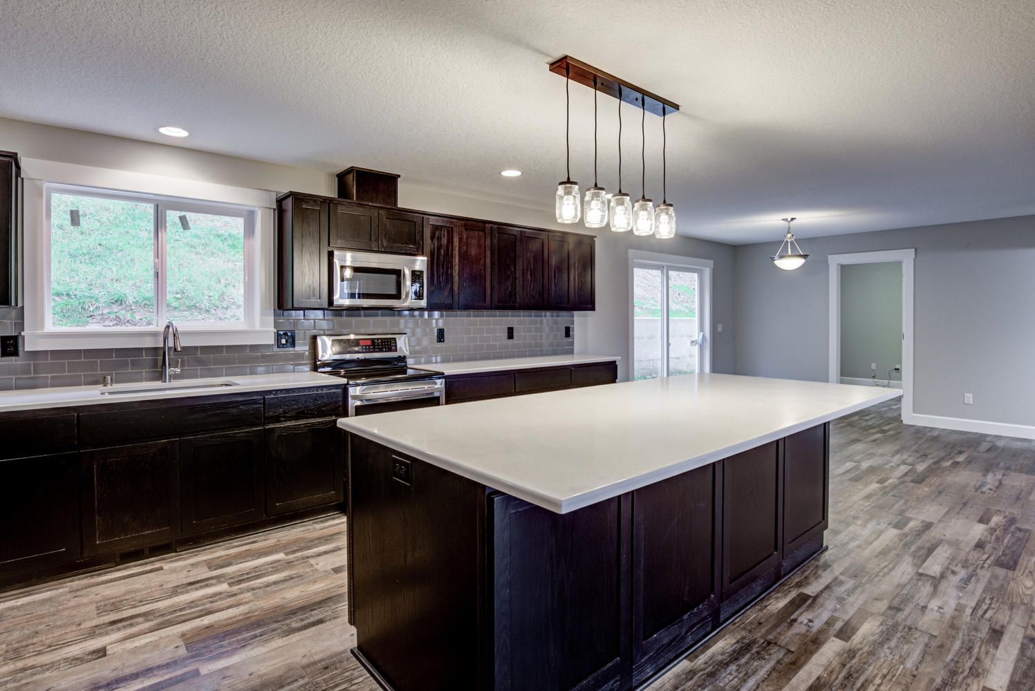 There is a large island in the middle of the kitchen.