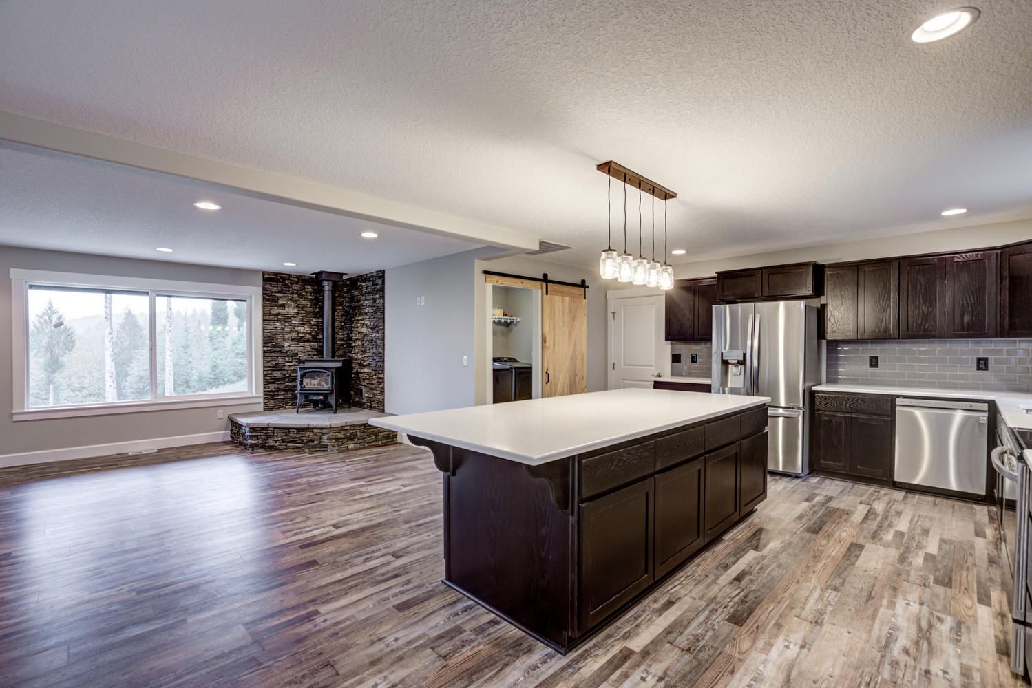 There is a large island in the middle of the kitchen.