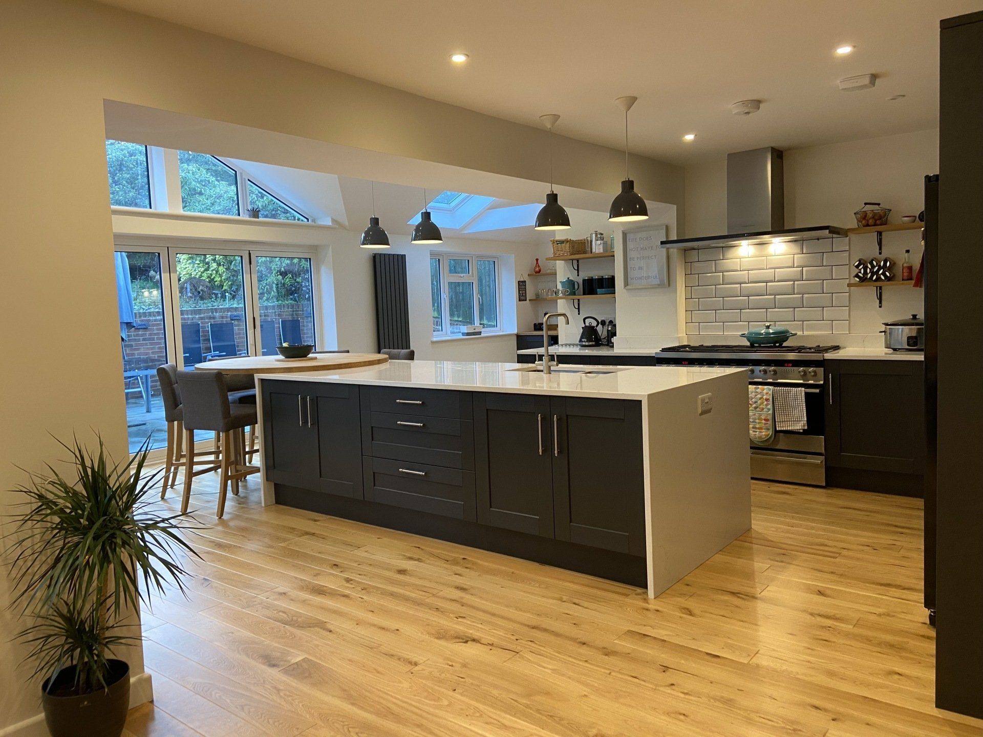 modern white and charcoal kitchen with tiled splashback