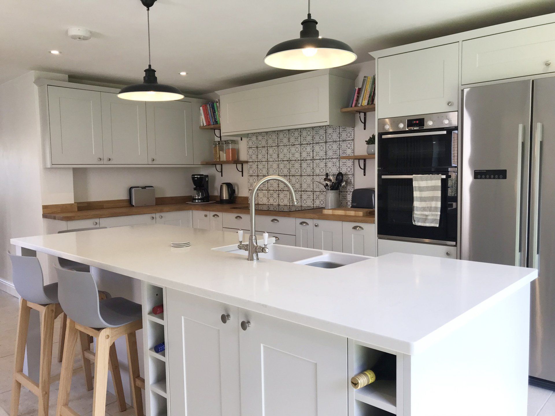 white modern kitchen with victorian tile splashback