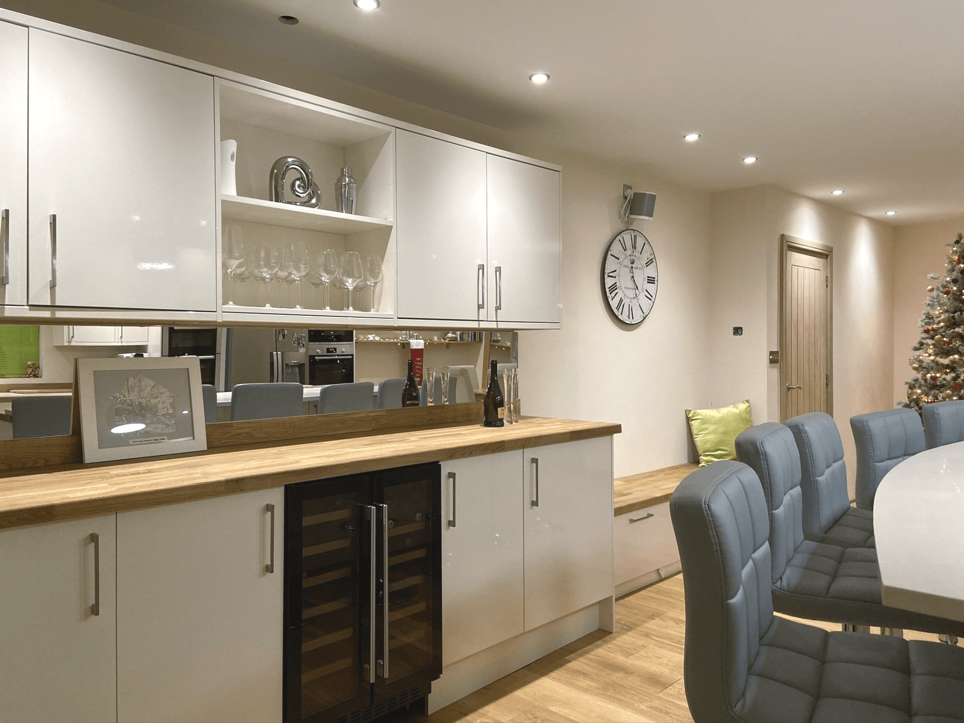 modern white gloss kitchen with bar unit