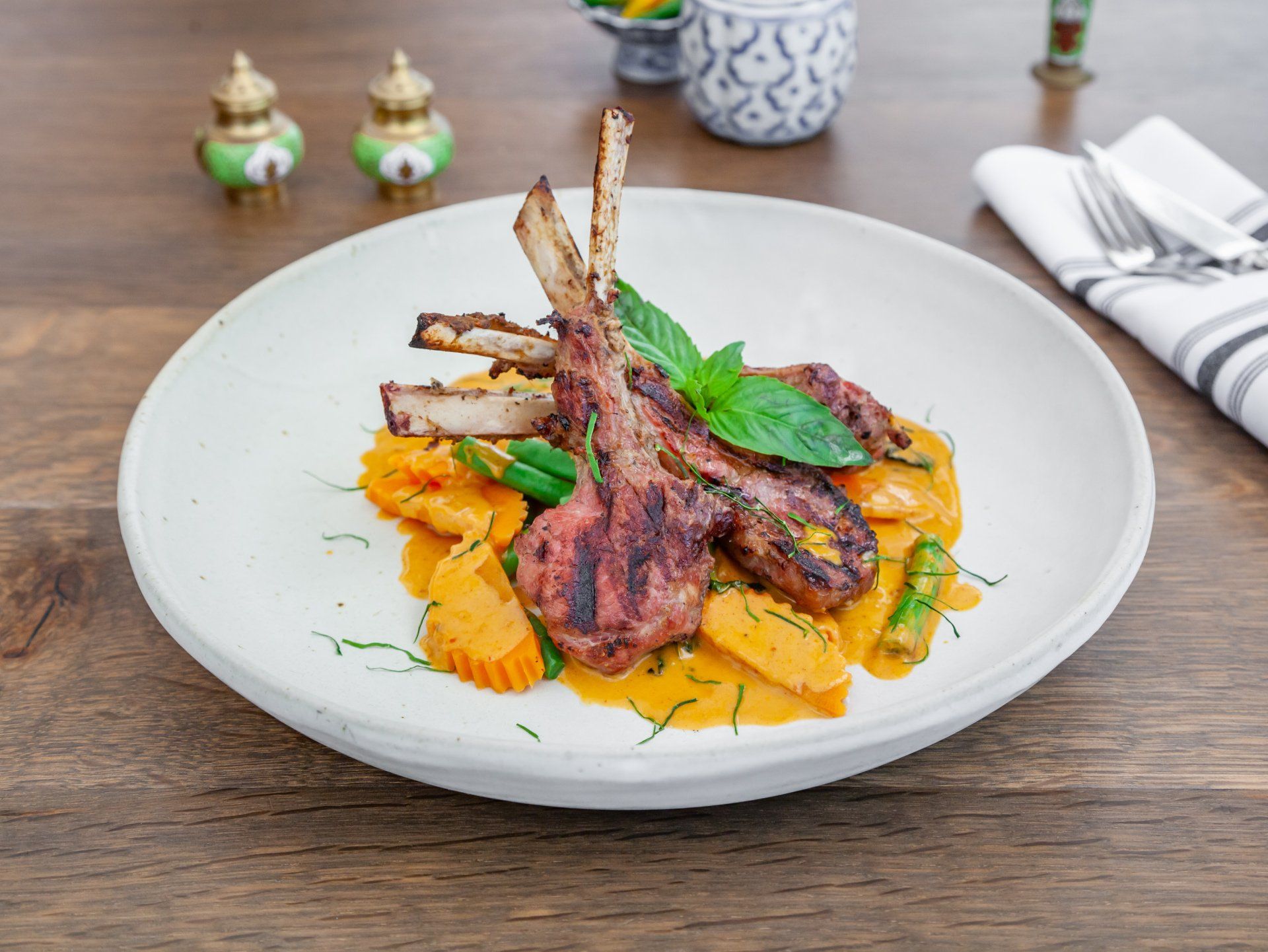 Rack of lamb , carrot, green bean with basil red curry.